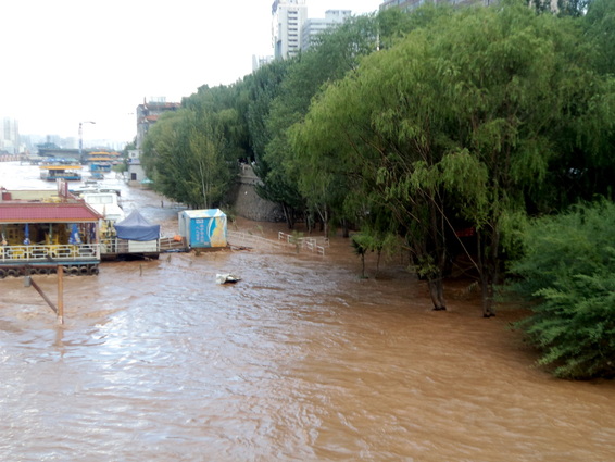 Riverboat restaurant approaches flooded on Yellow River in Lanzhou China