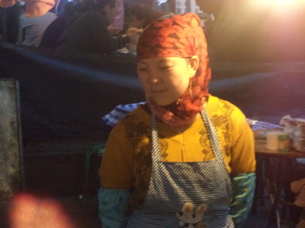 Lanzhou China night market, Muslim woman wearing bright scarf