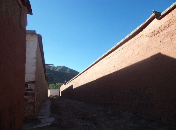 Sun lighting alley in Labrang Monastery in Xiahe China
