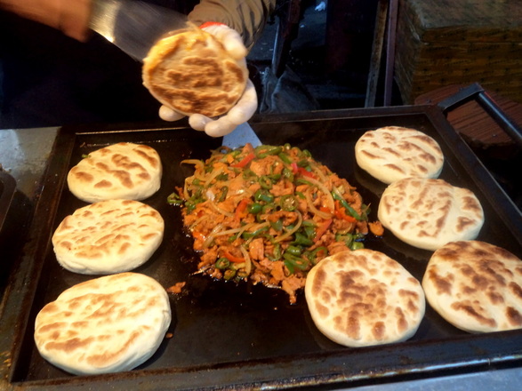 Grilled sandwich on Muslim bread night market Lanzhou China